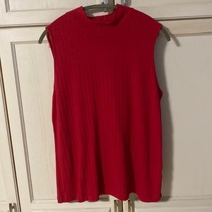 A Woman’s red top in XL